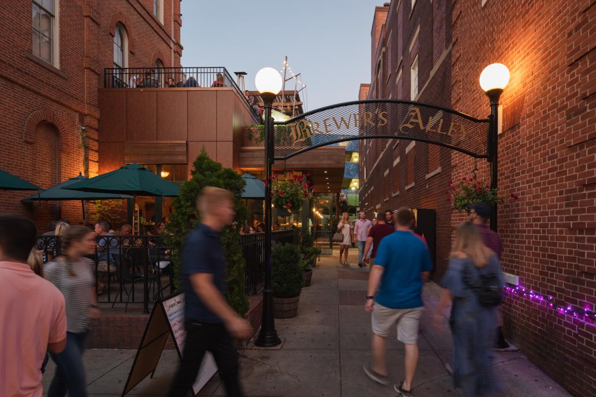 People walking through Brewer's Alley in Frederick, MD