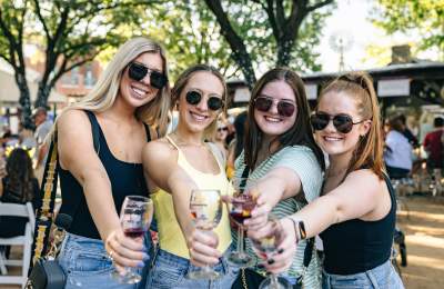 Women drinking wine at GrapeFest in Grapevine, Texas