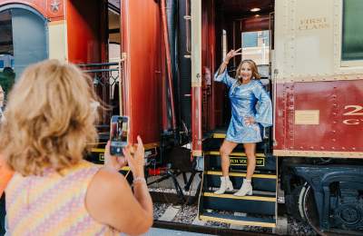 Woman dressed up for Grapevine Vintage Railroad's Disco Wine Train in Grapevine, Texas