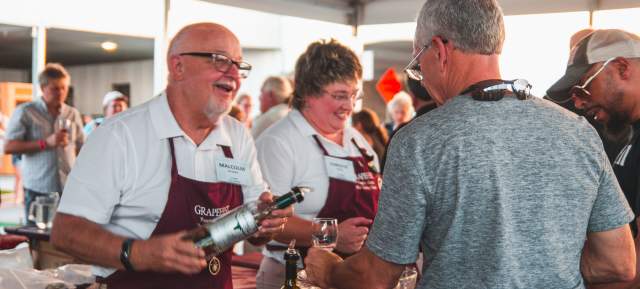 Volunteers serving guests at Grapefest in Grapevine, Texas