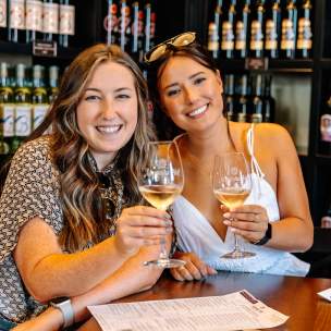Women toasting glasses of wine in Grapevine, Texas