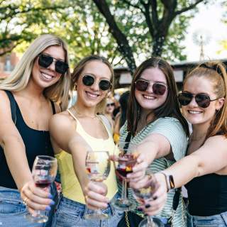 Women drinking wine at GrapeFest in Grapevine, Texas