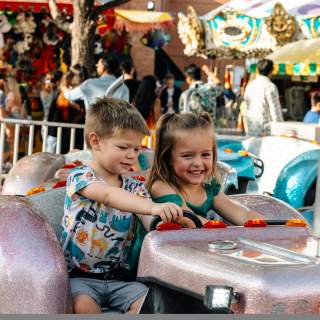 Children at Grapefest enjoying a festival ride