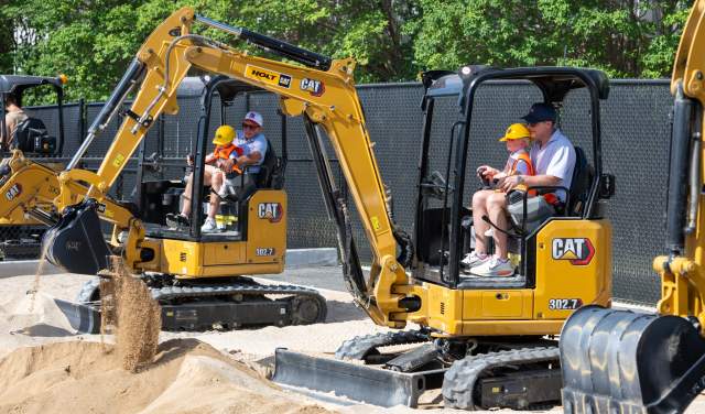People operating construction equipment at Dig World in Grapevine, Texas