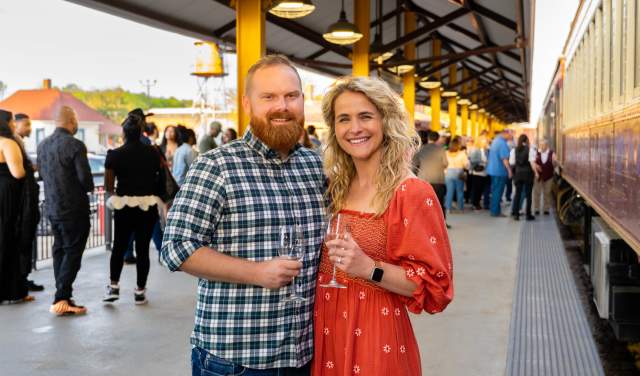 A couple enjoying wine as part of a special event wine train on Grapevine Vintage Railroad