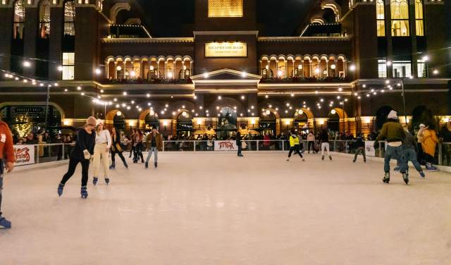 People skating at the Peace Plaza outdoor Ice Rink in Grapevine, Texas during the Christmas Capital of Texas