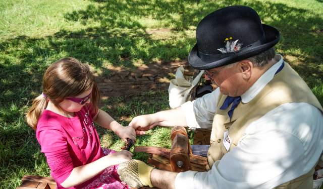 A child learning during an event at Nash Farm in Grapevine, Texas