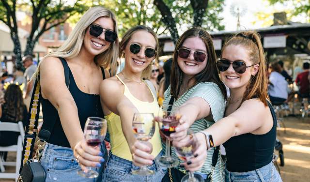 Women drinking wine at GrapeFest in Grapevine, Texas
