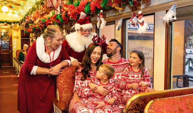 Family on board Santa's North Pole Express in Grapevine, Texas during the Christmas Capital of Texas