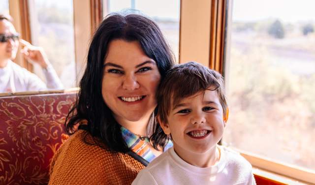 Mother and her son on a Grapevine Vintage Railroad train in Grapevine, Texas