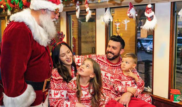 Family on board Santa's North Pole Express in Grapevine, Texas during the Christmas Capital of Texas