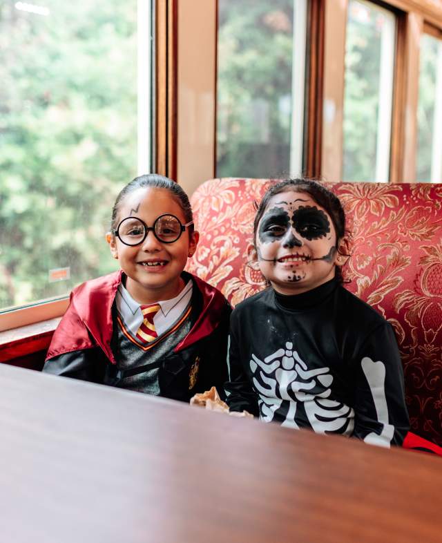 Kids dressed up in their Halloween costumes on a Grapevine Vintage Railroad train