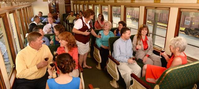 People Drinking Wine On A Train