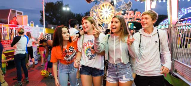 group of teenagers enjoying a carnival
