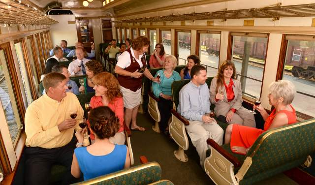 People Drinking Wine On A Train