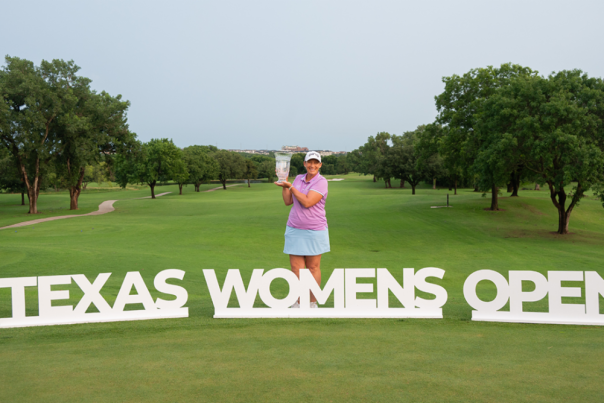 Angela Stanford holding Texas Women's Open trophy for Legends division