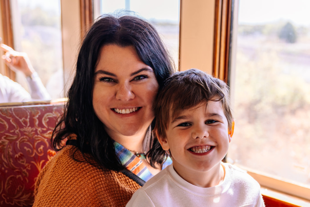 Mother and her son on a Grapevine Vintage Railroad train in Grapevine, Texas