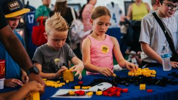 Kids playing with Legos at KidZone at Main Street Fest in Grapevine, Texas