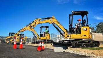 People operating construction equipment at Dig World in Grapevine, Texas