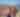 A couple wearing pink is hiking in the desert mountains