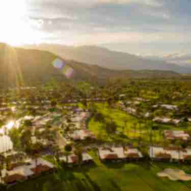sunset over mountains and golf course