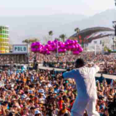 A massive crowd faces the main stage at Coachella 2023.