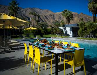 Thanksgiving by the pool with mountains and palm trees