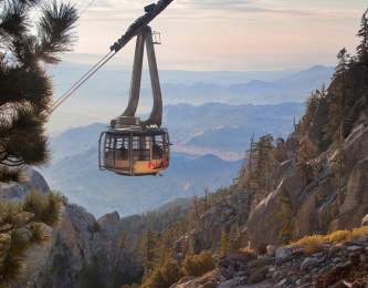 A Palm Springs Aerial Tramway tram car travels through the Chino Canyon to the Mountain Station atop Mt. San Jacinto.