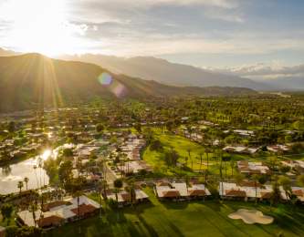 sunset over mountains and golf course