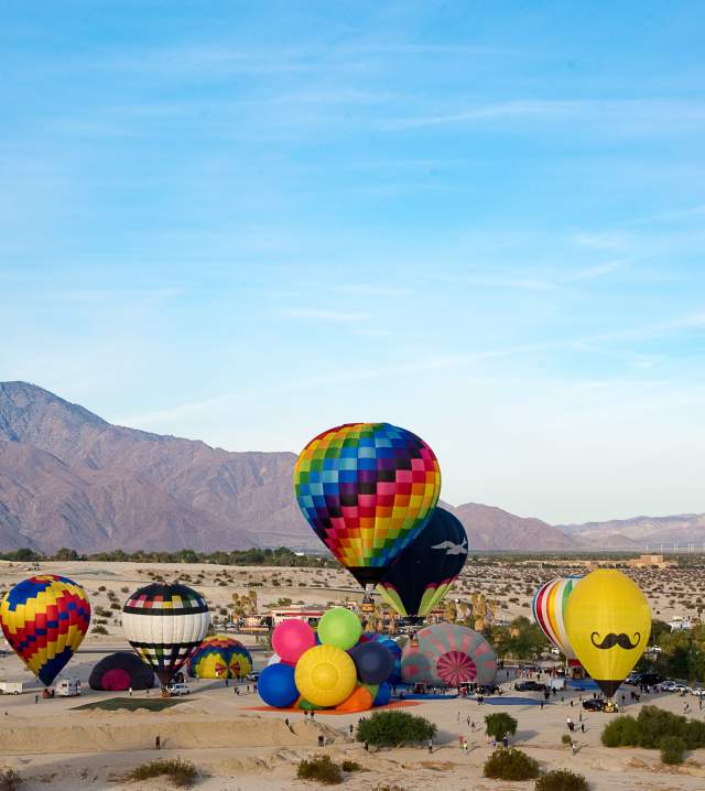 Hot air balloon festival with mountains