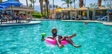 Man in pool float