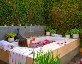Person relaxing in outdoor spa