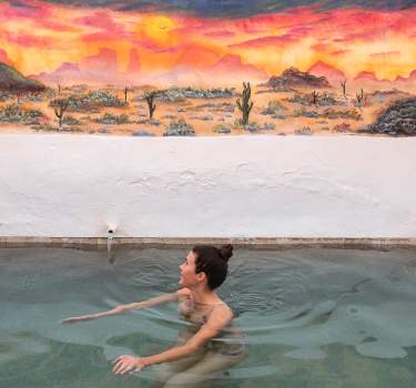 A private mineral hot spring pool at Delight's Hot Springs in Tecopa, California