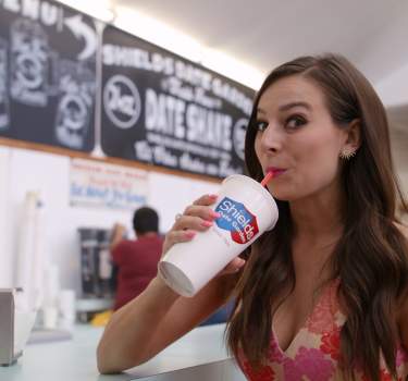 Alle Pierce drinking a date shake from Shield's.