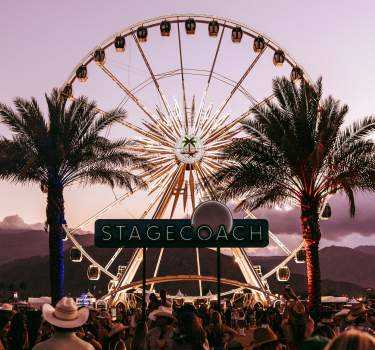 The Stagecoach sign with the ferris wheel and palm trees in the background.