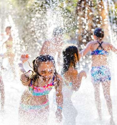 Children play in a splash pad at Hyatt Regency Indian Wells Resort & Spa.