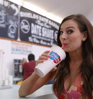 Alle Pierce drinking a date shake from Shield's.