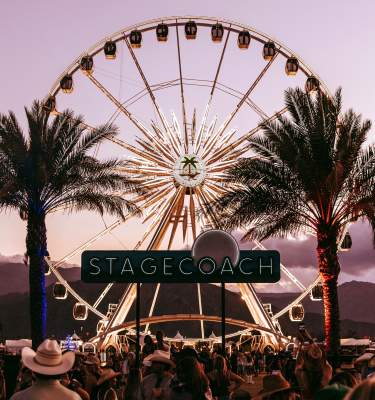The Stagecoach sign with the ferris wheel and palm trees in the background.