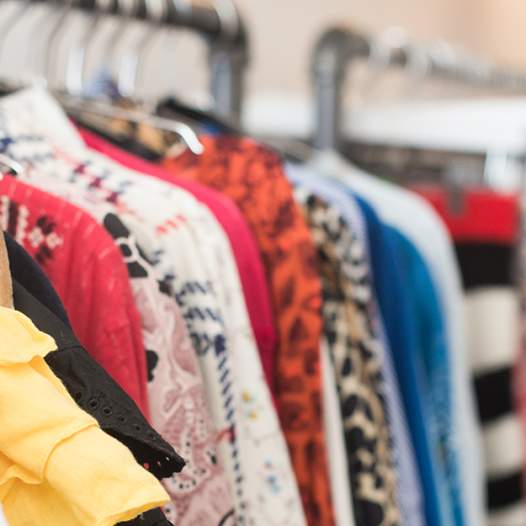 A shot of the clothing racks at Pre Loved Palm Springs