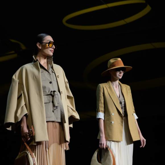 Two models pose on the runway during Fashion Week El Paseo 2023