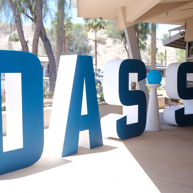 OASIS letters on a patio