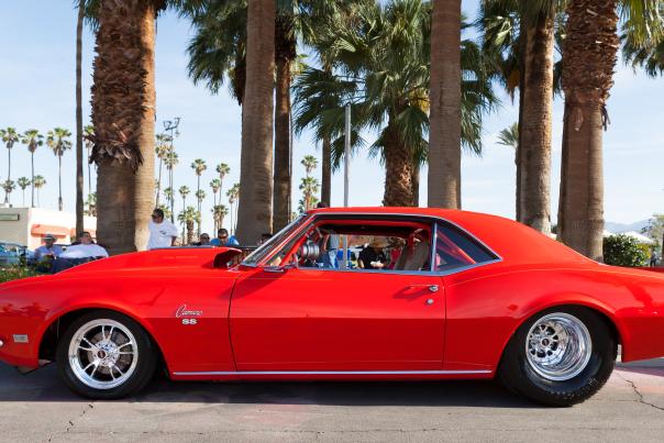 Beautiful red classic car parked on street in Indio, CA.