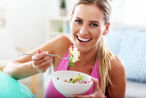 Woman eating salad