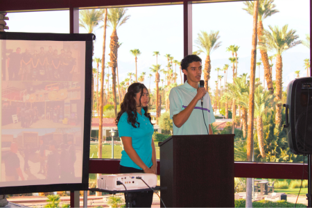 student presenting at podium