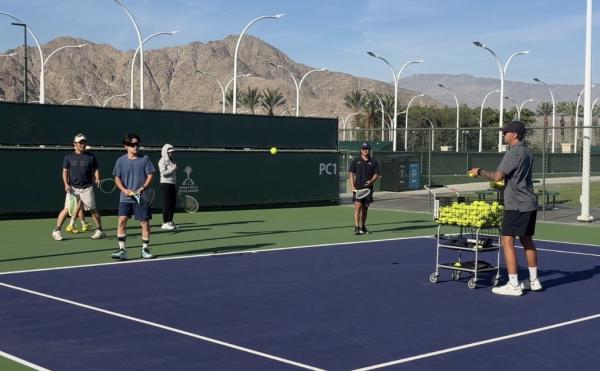 Japanese media playing tennis at Indian Wells Tennis Garden as part of a sports focused FAM.