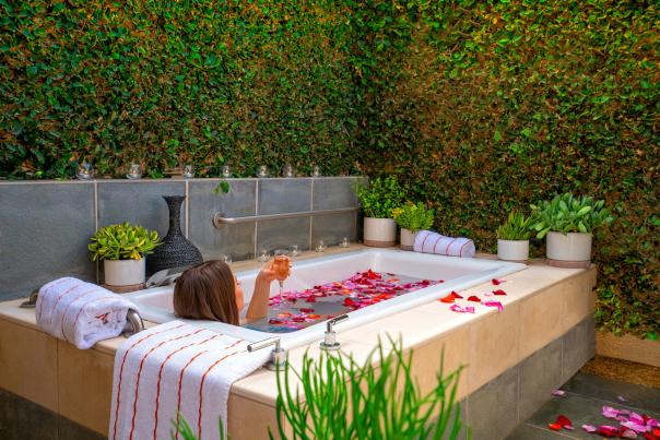 Person relaxing in outdoor spa