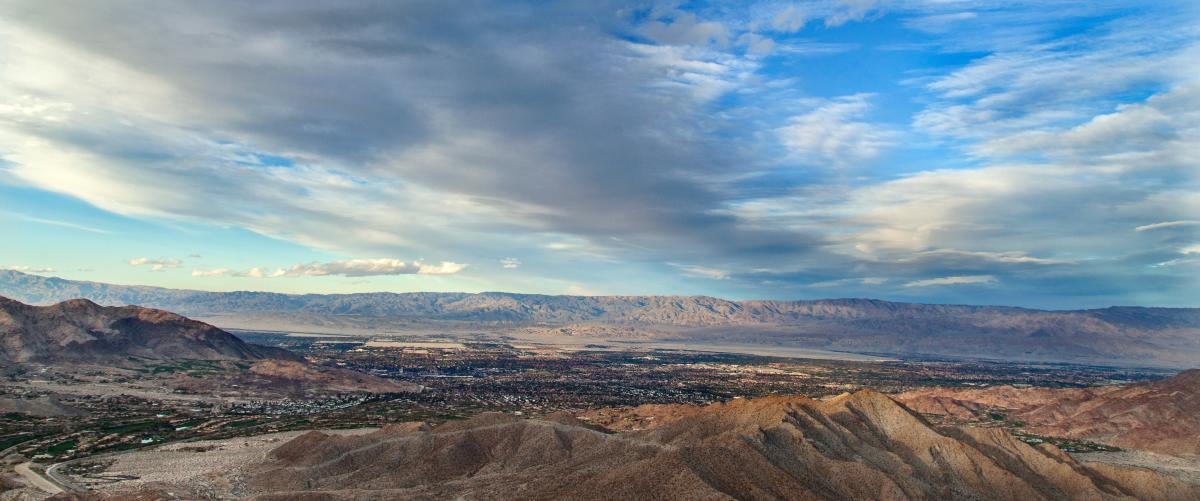 Beautiful clouds and blue sky surround the vista of Greater Palm Springs.