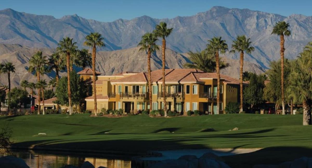 The Front Of The Marriott’s Desert Spring Villas With Mountains In The Background In Greater Palm Springs
