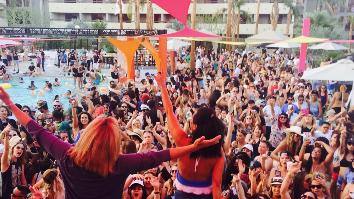 Lots of people gather poolside during The Dinah event.
