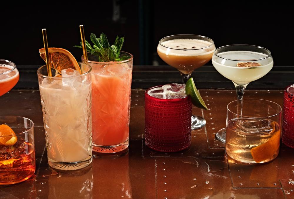 Various cocktails are lined up on a table at El Jefe at Saguaro in Palm Springs.